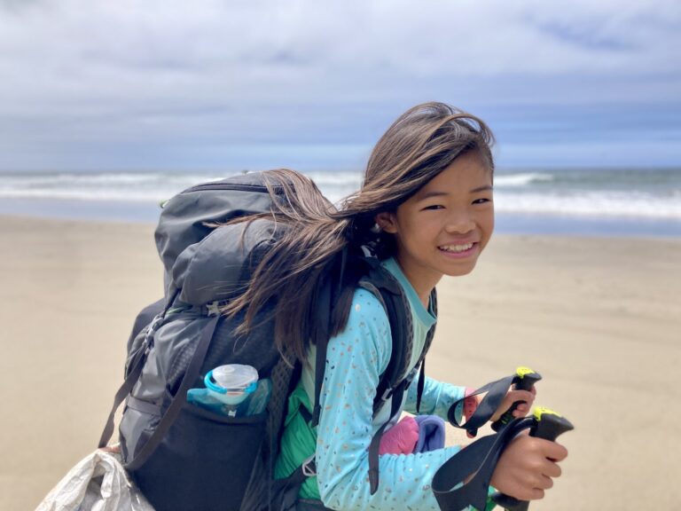 Young backpacker on beach